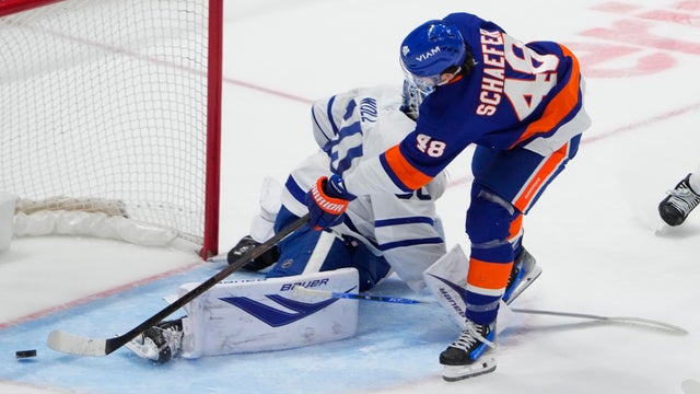 New York Islanders Defenseman Matthew Schaefer (48) scores a goal against Toronto Maple Leafs Goalie Joseph Woll (60) during the third period of the National Hockey League game between the Toronto Maple Leafs and the New York Islanders on January 3, 2026, at UBS Arena in Elmont, NY. 