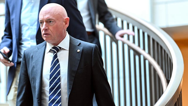 Sen. Mark Kelly, a Democrat from Arizona, arrives for an all-Senate briefing at the U.S. Capitol in Washington, DC, on Dec. 16, 2025 