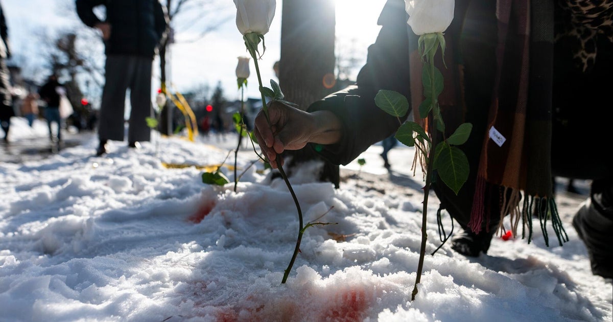 Demonstrators hold vigil for woman whom ICE agent shot and killed