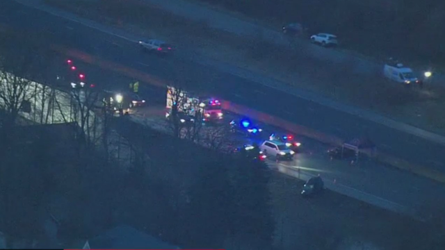 Automobile tuning, lightbar flashing LED blue light is mounted on the roof to look like an American police car, individual modification of the design, dark background, copy space 