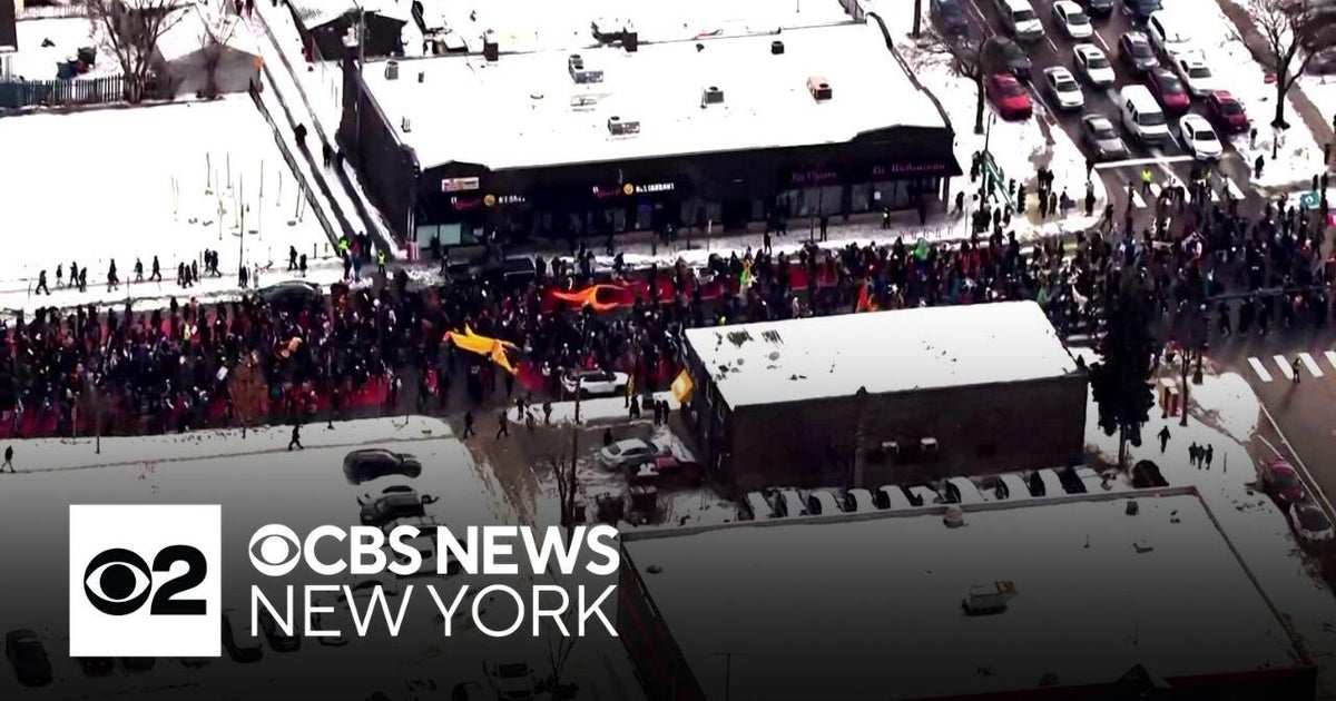 Thousands take to streets to protest Minneapolis ICE shooting - CBS New ...