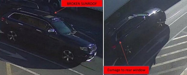 A surveillance photo of a dark blue Jeep Grand Cherokee 