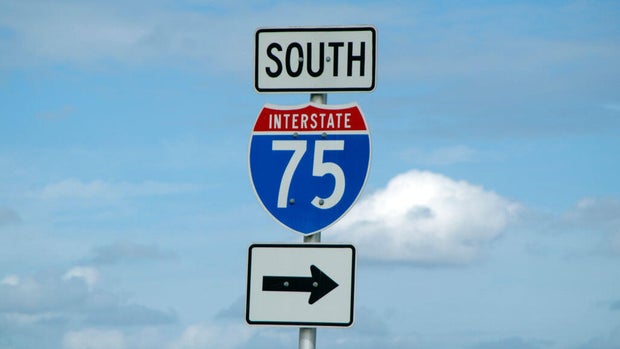 Highway 75 south road sign against a blue sky Florida USA This section of the highway is called Alligator Alley 