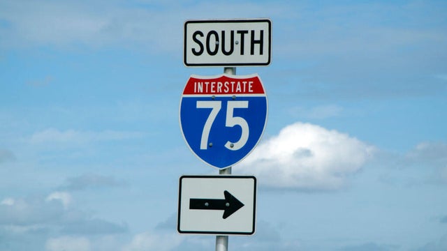 Highway 75 south road sign against a blue sky Florida USA This section of the highway is called Alligator Alley 