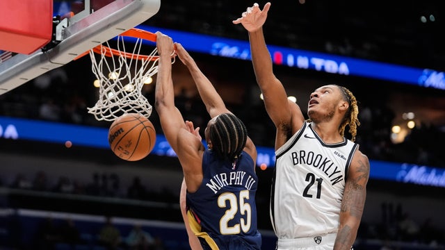 New Orleans Pelicans forward Trey Murphy III (25) slam dunks against Brooklyn Nets forward Noah Clowney (21) in the first half of an NBA basketball game, Wednesday, Jan. 14, 2026, in New Orleans. 