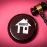 Bankruptcy Legal Concept with House Icon and Judge Gavel on Pink Background 