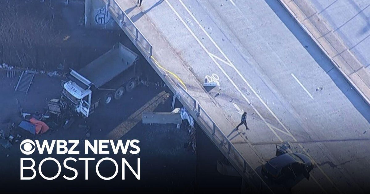 Truck plummets off Boston overpass after colliding with car