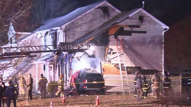 Car crashes into house in Mullica Hill, sparking fire, officials say 