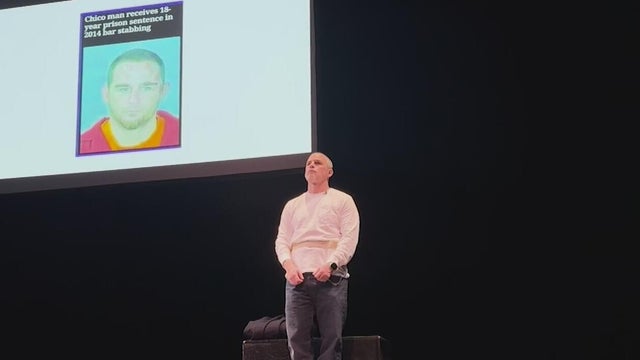 A man standing on a theater stage 