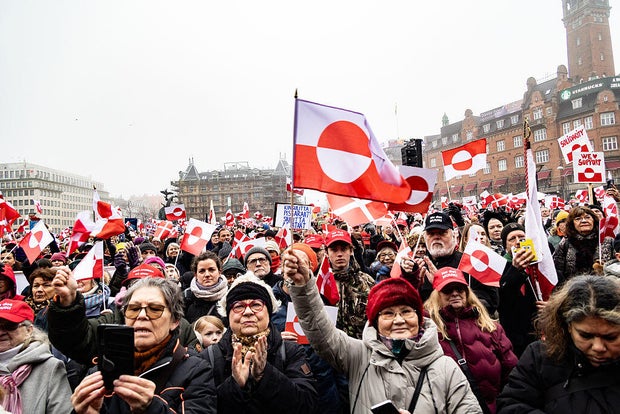 Protesters wave Greenland flags during a demonstration at City Hall Square in Copenhagen on Jan. 17, 2026. 