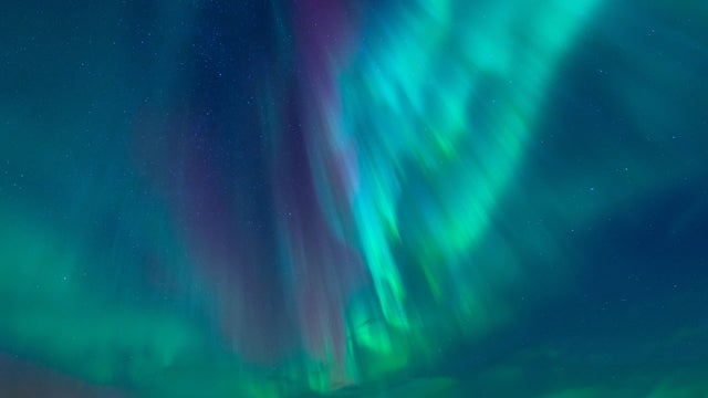 Strong Kp index Aurora Borealis (Northern Lights) exploding over on sky at Norway 