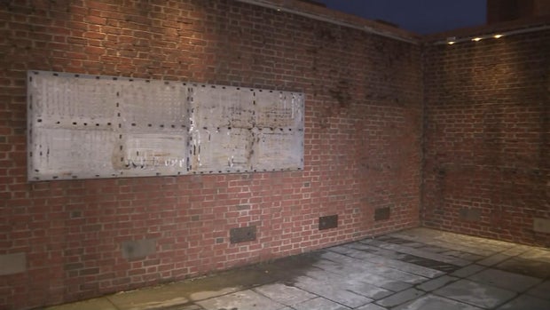 A brick wall at President's House shows where the signs used to be 