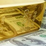 Yellow Gold Ingot Bar with Dollar Bill Reflection. 
