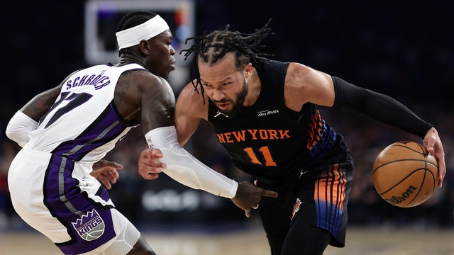 Jalen Brunson #11 of the New York Knicks drives past Dennis Schroder #17 of the Sacramento Kings during the first quarter at Madison Square Garden on January 27, 2026 in New York City. 