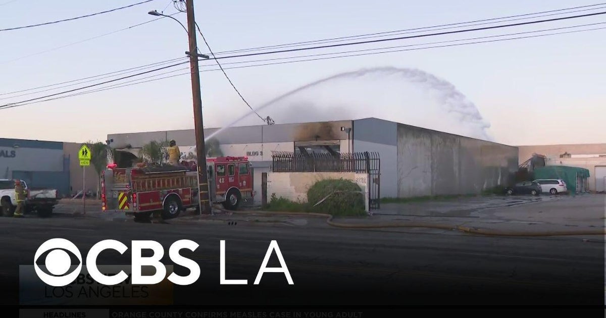 Fire crews continue to work for a second day at a South El Monte recycling center blaze