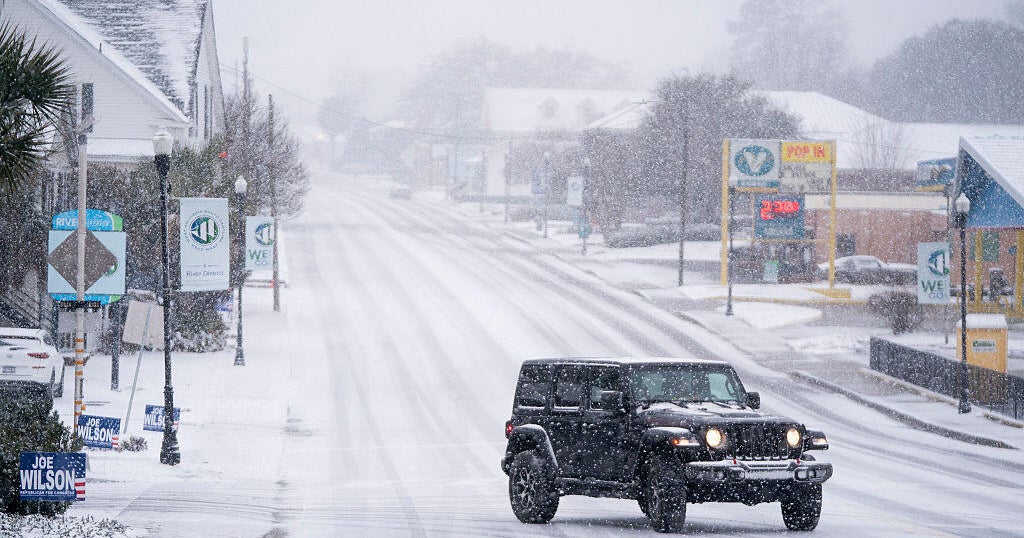 Powerful storm hits an East Coast still buried under last week's snow