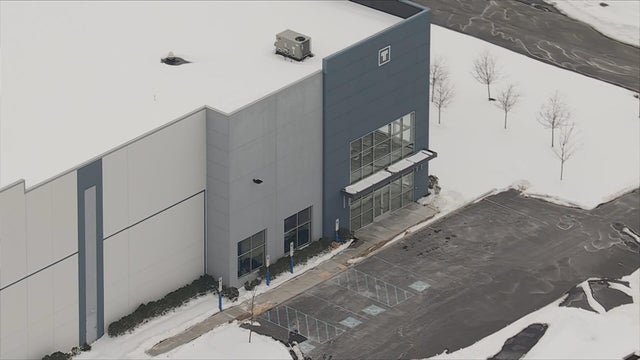 Overhead photo from a chopper of the warehouse in Bern Township, it is gray and blue 