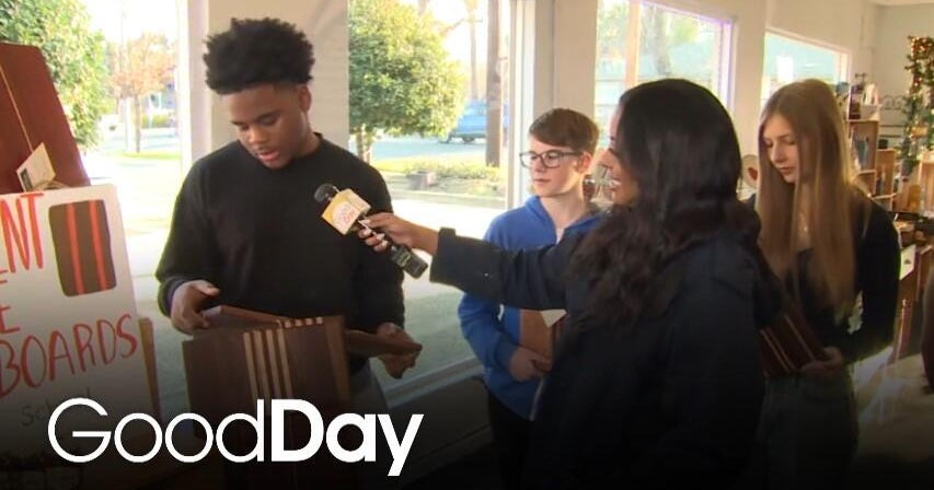 Ashley is checking out student-made cutting & serving boards!