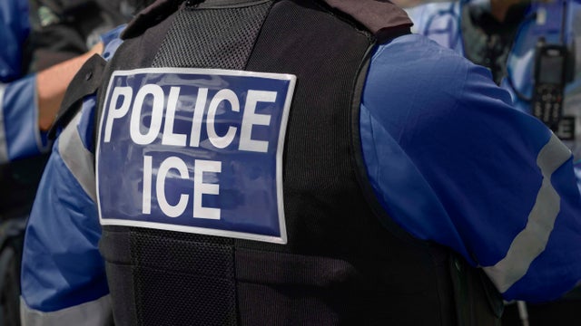Ice Police agents - Immigration and Customs Enforcement. Close-up of POLICE ICE marking on the back of worn by a trio of DHS police officers at the scene of an incident. 