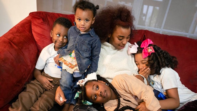 Ayanna Mizani Harris-Rashid is pictured with her children 