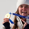 Team USA's Breezy Johnson shows her gold medal at the 2026 Winter Olympics 