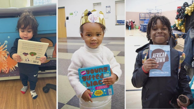 Kids receiving books through the West Philadelphia-based nonprofit A Book A Day 