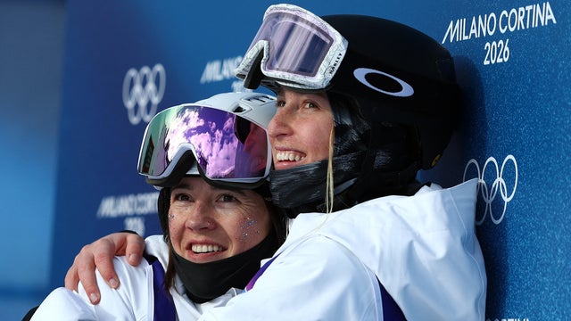 Jaelin Kauf and Elizabeth Lemley of Team USA hug each other after their runs in the women's moguls finals at the Winter Olympics in Livigno, Italy, Feb. 11, 2026. 
