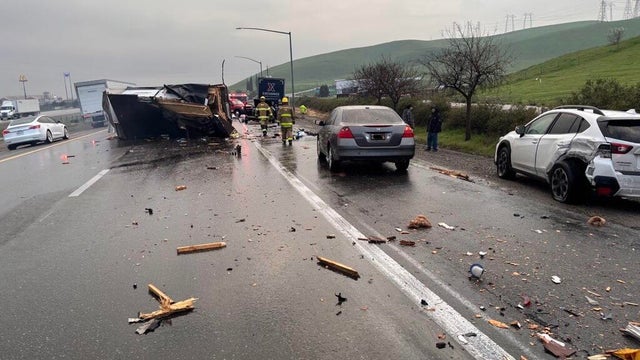 debris on a highway after a multi-vehicle crash 