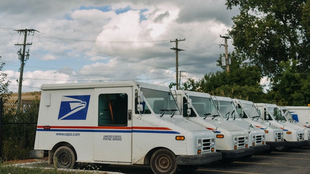 USPS truck parked in line 