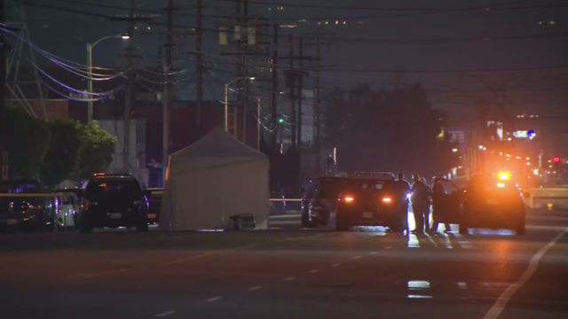 Simple Conceptual Image of Silver Handcuffs on Blue Surface 