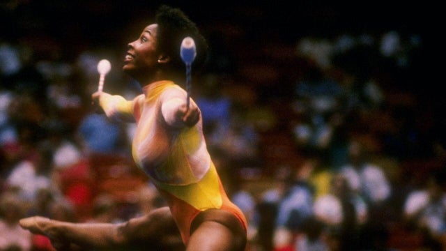 Wendy Hilliard jumps through the air. 