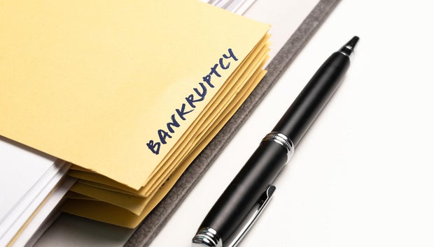 ring binder with word BANKRUPTCY written on binding divider 