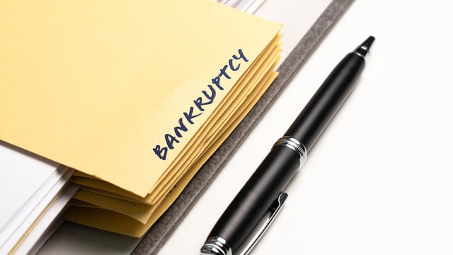 ring binder with word BANKRUPTCY written on binding divider 