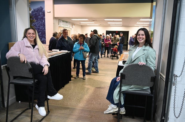 People pose for a photo at the opening day of the Philly Home and Garden show 