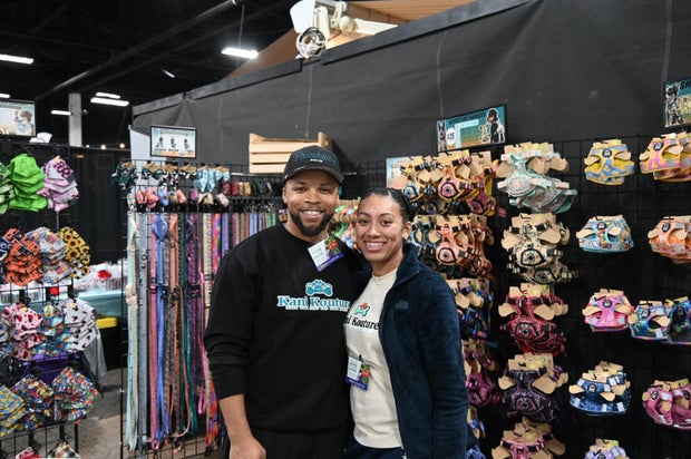 People pose for a photo at the opening day of the Philly Home and Garden show 