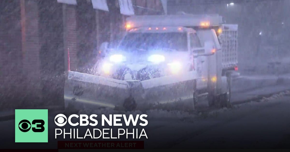 Crews head out to clear the roads in Doylestown, Pennsylvania, as snow starts to stick