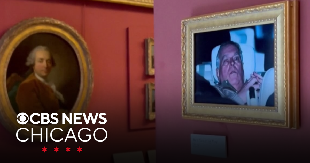 Activists hang photo of former prince Andrew in the Louvre