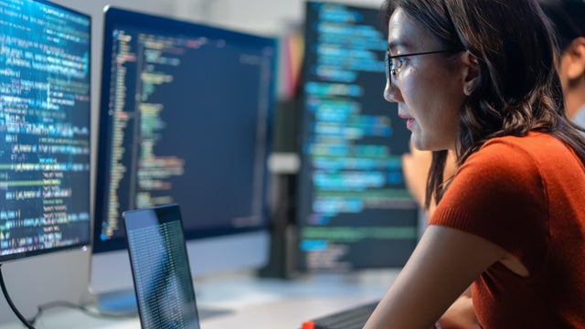 Manager presenting business growth using interactive screen in modern office 