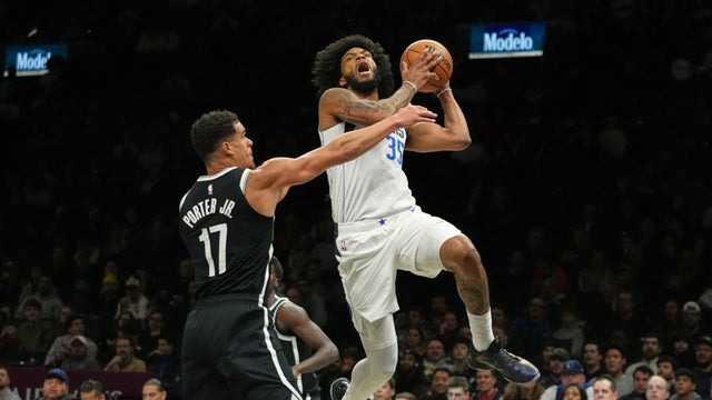Dallas Mavericks' Marvin Bagley III (35) drives past Brooklyn Nets' Michael Porter Jr. (17) during the first half of an NBA basketball game Tuesday, Feb. 24, 2026, in New York. 