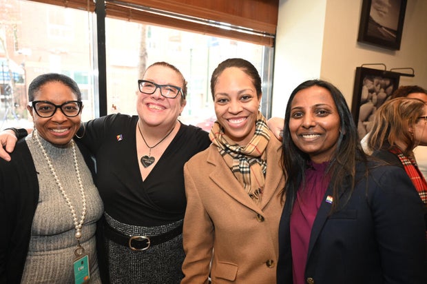 People pose for a photo at the opening of the Philly LGBTQ+ visitor center 