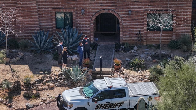 In an aerial view, law enforcement officials visit Nancy Guthrie's residence on Feb. 25, 2026, in Tucson, Arizona. 