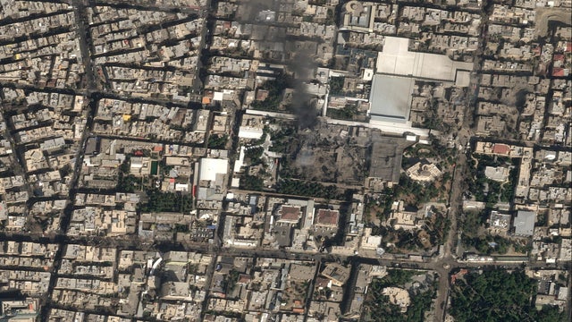 A satellite image shows black smoke rising and heavy damage at Iranian Supreme Leader Ayatollah Ali Khamenei's compound in Tehran 