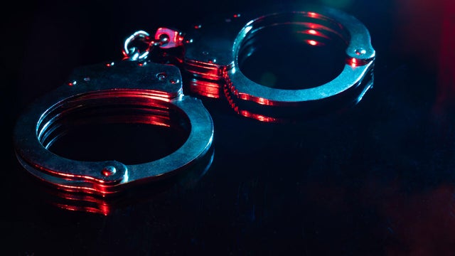 Handscuffs at Night with Red and Blue Light 