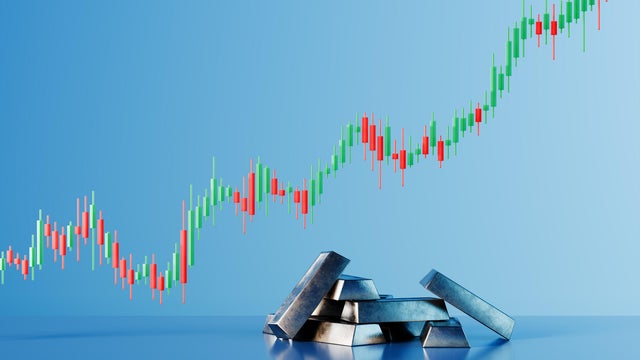 Silver Ingot Bars with Ascending Financial Trading Chart and Wealth Prosperity Concept 