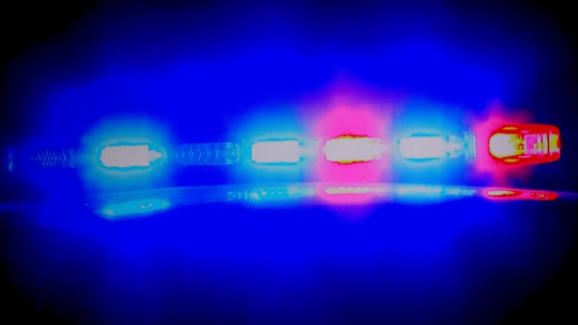 Cop car in pursuit on a night time scene 