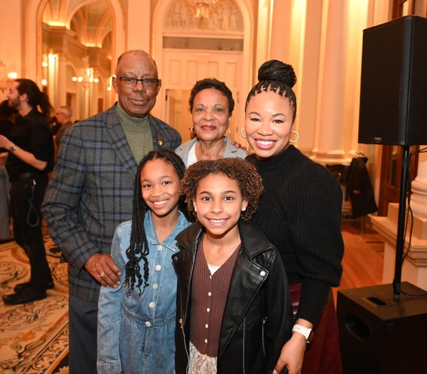 People post for photos at Alvin Ailey American Dance Theater Party at Ensemble Arts 