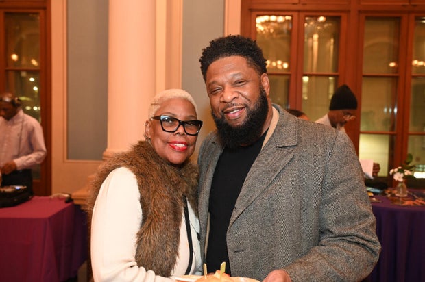 People post for photos at Alvin Ailey American Dance Theater Party at Ensemble Arts 