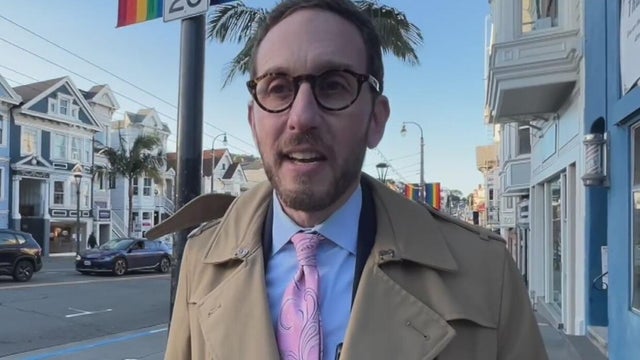 a man poses for a photo for an interview 