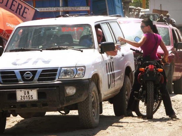 Librandi on her motorcycle in Haiti