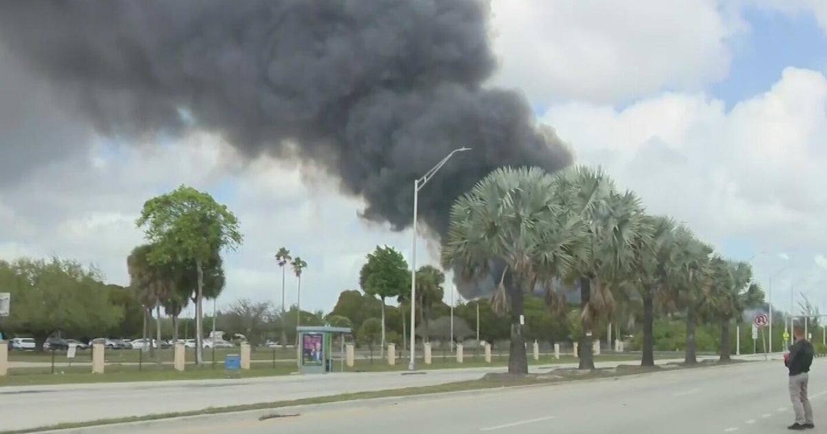 Fire at northwest Miami-Dade warehouse continues to rage as crews from around region race to scene